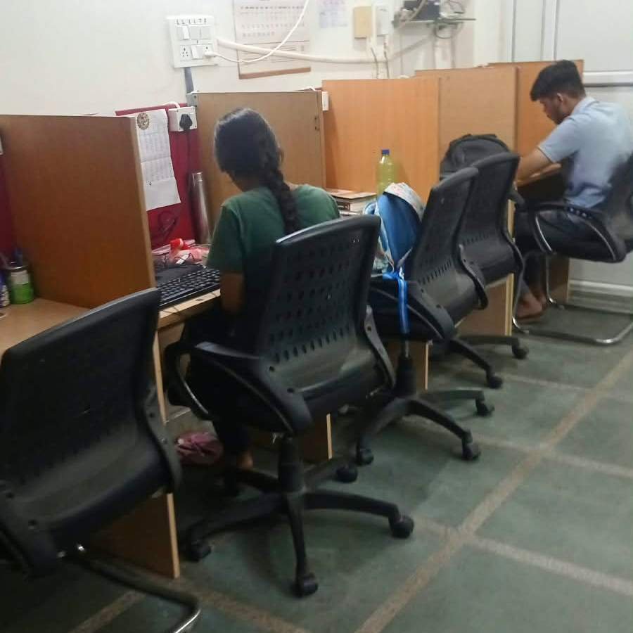 Students studying at their desks in The Library