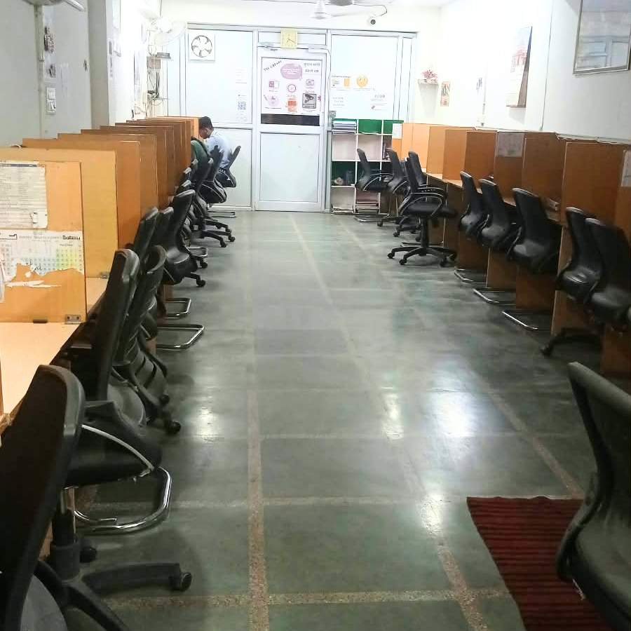 Study hall at The Library with rows of desks and chairs